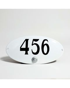 Oval shaped doorbell with house number convex