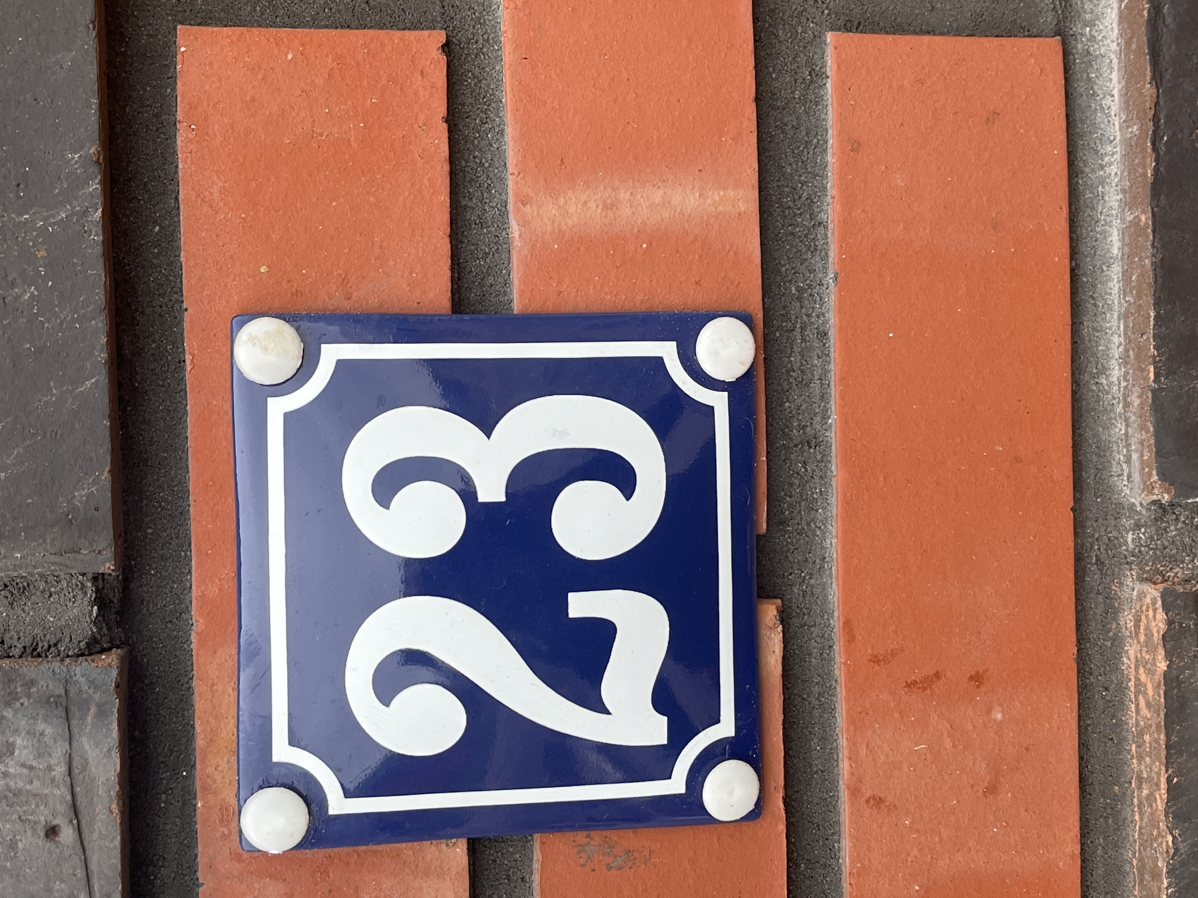Blue enamel house number